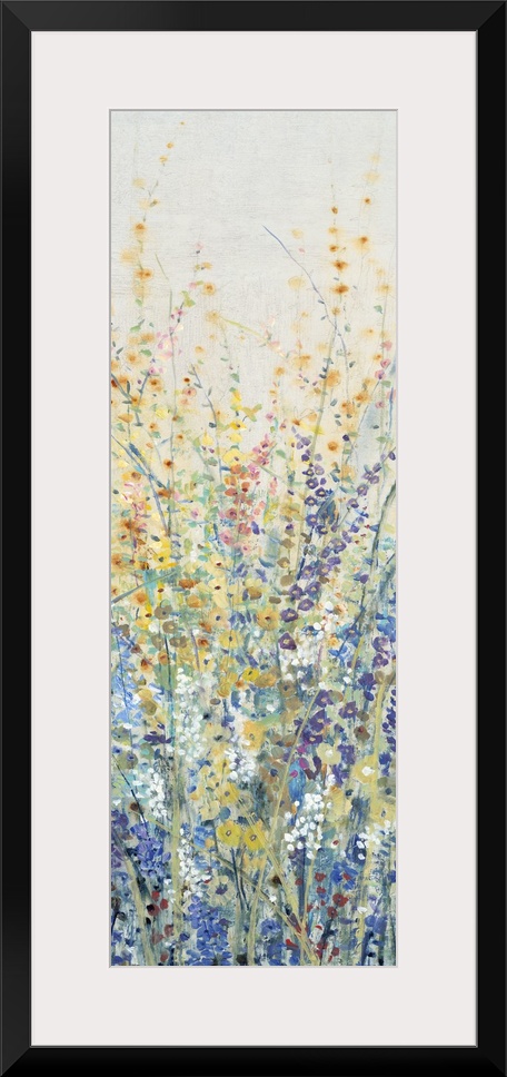 Vertical panel of blooming yellow and blue wildflowers in a field.