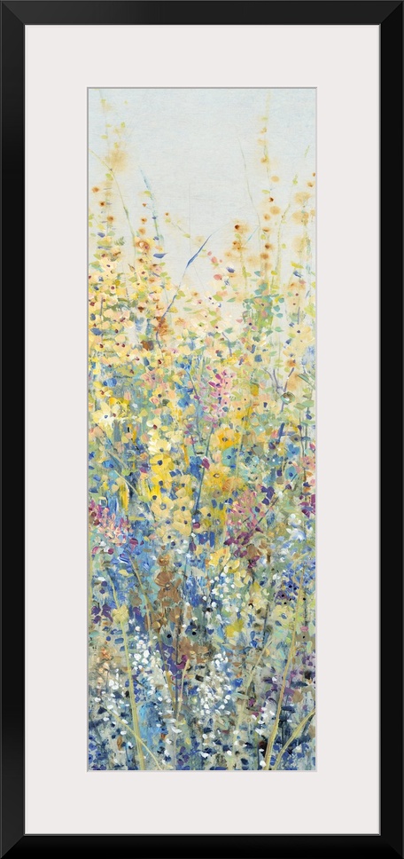 Vertical panel of blooming yellow and blue wildflowers in a field.