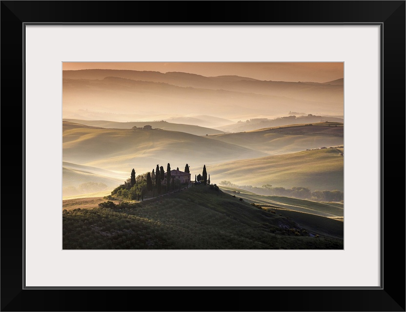 Idyllic landscape on a misty morning in the Tuscan countryside.