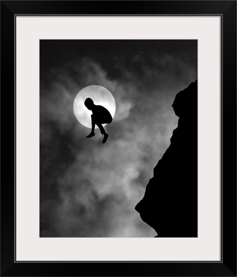 Silhouette of a person jumping off a cliff, with the moon directly behind.