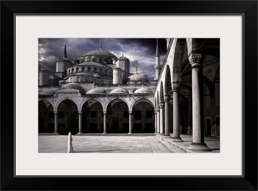 A woman in the courtyard of the Blue Mosque in Istanbul.