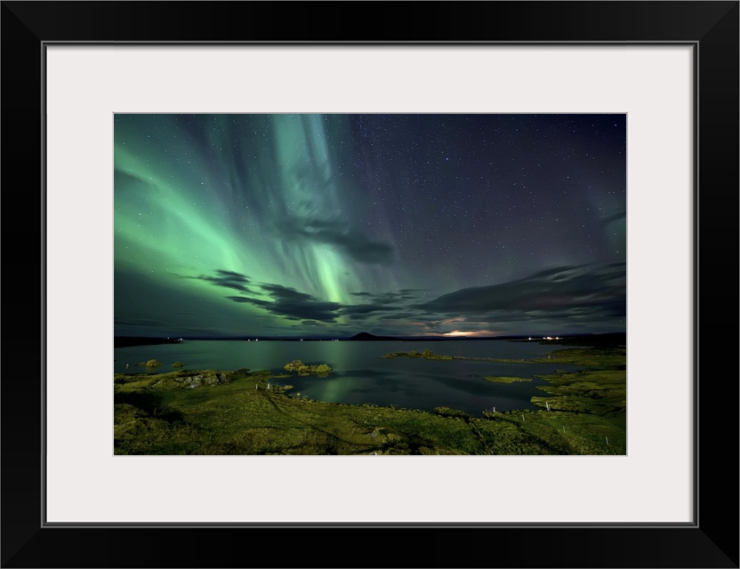 The northern lights seen above Myvatn Lake in Iceland at night.
