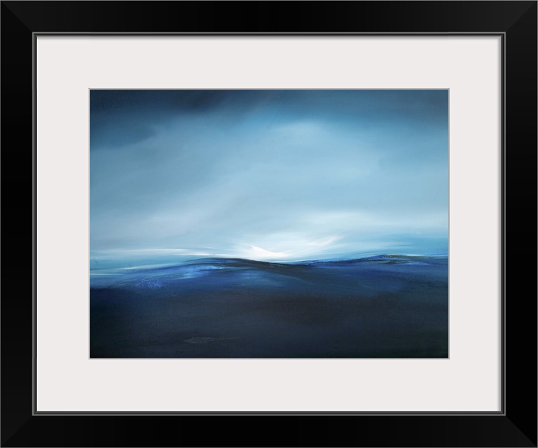 A seascape with stark contrast between the dark see and light sky.