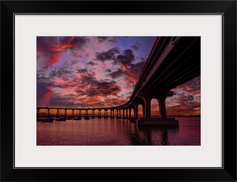 The Coronado Bridge spans the City of San Diego to Coronado Island. This image taken before sunrise and calm waters on San...