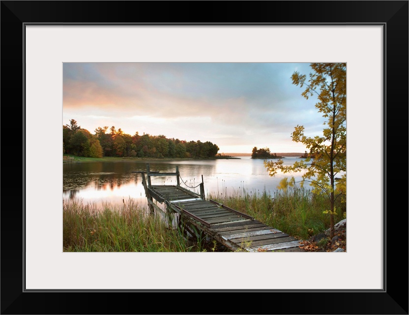 A Dock On A Lake At Sunrise Near Wawa; Ontario, Canada