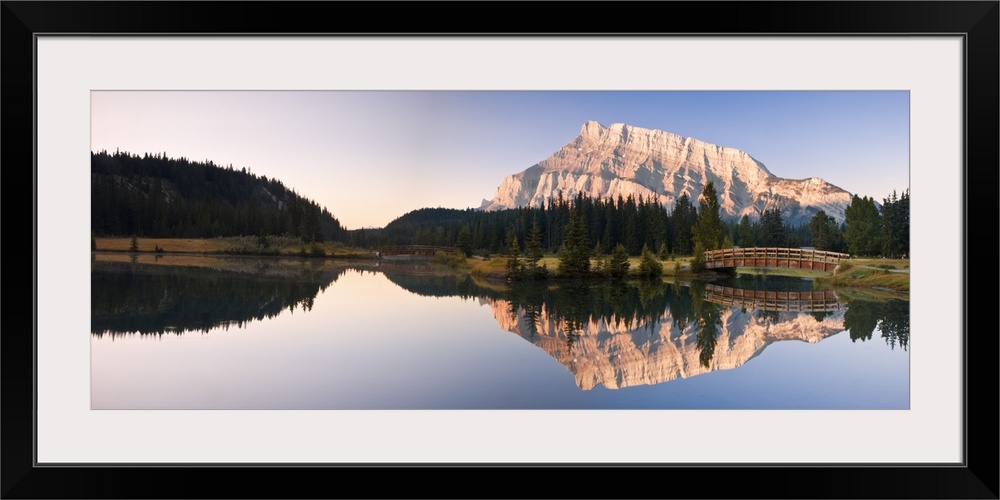 A Scenic Shot Of A Mountainside And Small Bridge; Banff National Park, Alberta, Canada