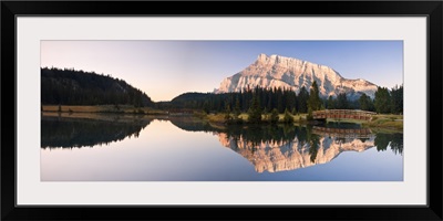 A Scenic Shot Of A Mountainside And Small Bridge; Banff National Park, Alberta, Canada