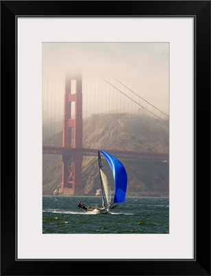 A Skiff sails in the San Francisco Bay near the Golden Gate Bridge; San Francisco Bay, California