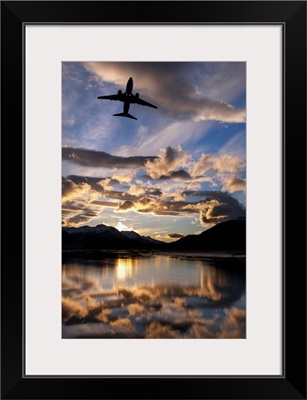 Alaska Airlines jet takes off from Juneau International airport at dawn, Juneau, Alaska