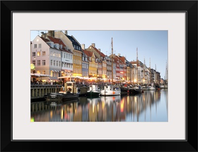 Boats And Townhouses Along The Nyhavn Canal In Copenhagen