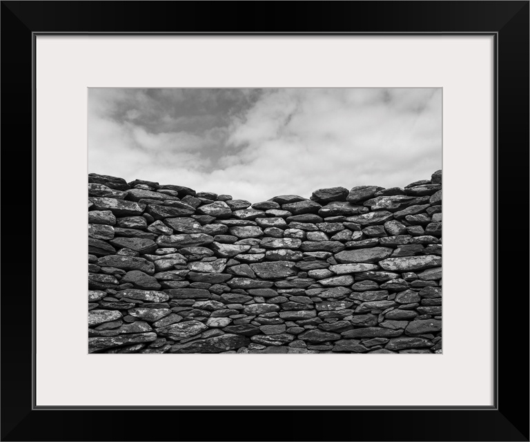 Close-up of a stone wall and clouds in the sky, Ballyferriter, county Kerry, Ireland.