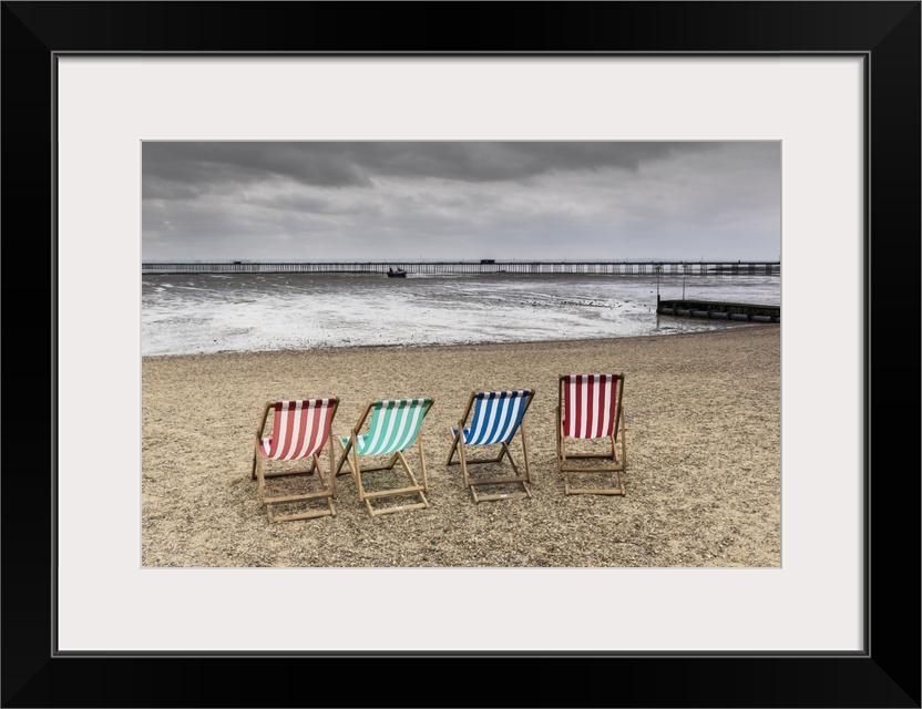 Empty deckchairs on Jubilee Beach in Southend on a cloudy day.