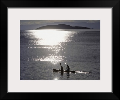 Fishermen Going Past The Island Of Domwe At Dusk; Malawi, Africa