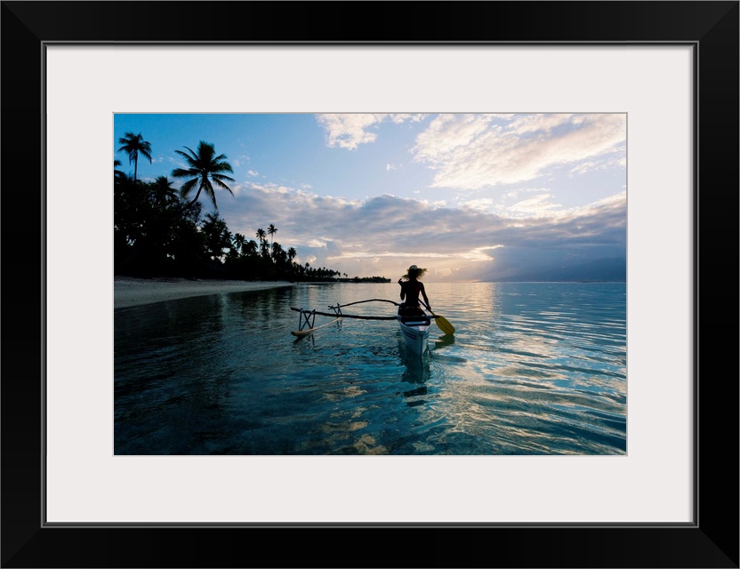 French Polynesia, Moorea, Woman Paddling In Outrigger Canoe Along Shoreline