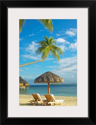 French Polynesia, Tahiti, Bora Bora, Lounge Chairs And Thatch Umbrella On Beach