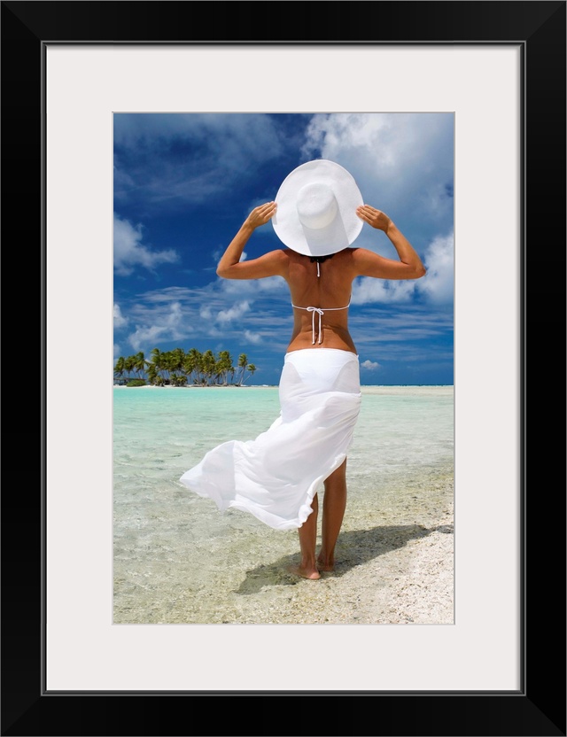 French Polynesia, Tuamotu Islands, Rangiroa Atoll, Woman Standing At Ocean's Edge