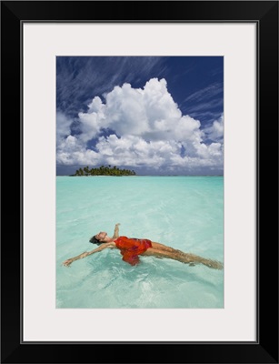 French Polynesia, Woman Floating In Ocean Water