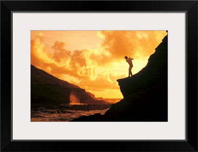 Hawaii, Golfer Standing On A Cliff And Swinging A Golf Club