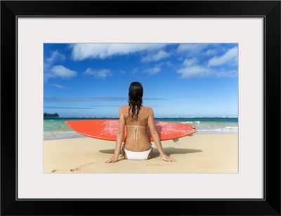 Hawaii, Kauai, Woman Sitting On Beach With Surfboard