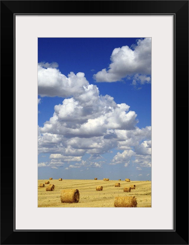 Hay Bales With White Clouds