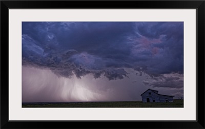 Lightning strikes over the prairies  and abandoned farm house, Val Marie, Saskatchewan