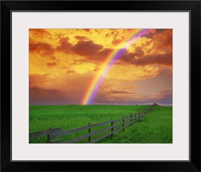 Rainbow In Country Field With Gold Clouds