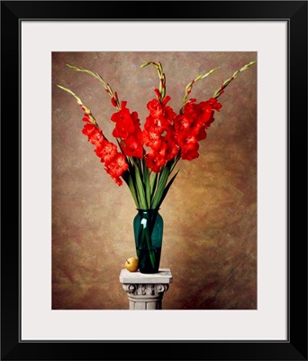 Red gladiolas in a vase on a pedestal