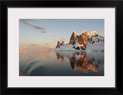 Reflections Of Cliffs And Mountains In The Lemaire Channel At Sunset, Antarctica