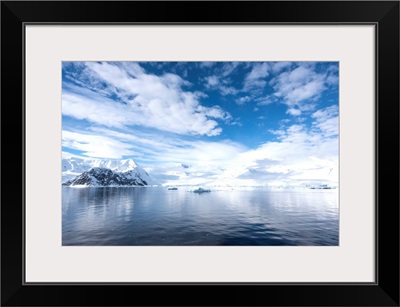 Sky reflected in water in Neko harbor, Antarctica