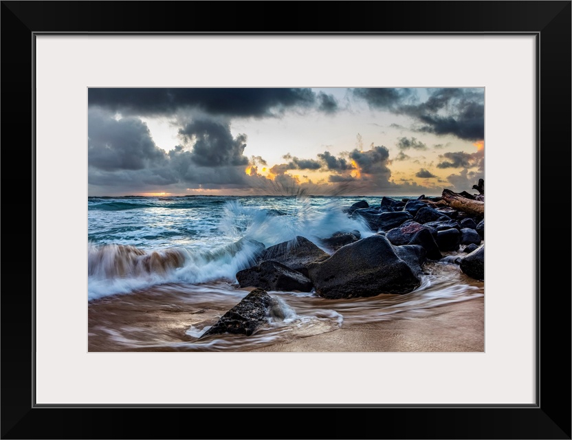 Sunrise through the clouds over the Pacific Ocean, viewed from Lydgate beach, Kapaa, Kauai, Hawaii, united states of America.
