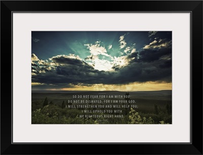 Sunset Shining Through Dark Clouds Over A Landscape And Scripture From Isaiah 41:10