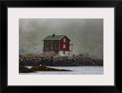 Traditional Fishing Village House Next To Shoreline, Lofoten, Arctic Circle, Norway