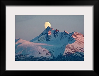 View of moon rising behind OMalley Peak Chugach Mountains