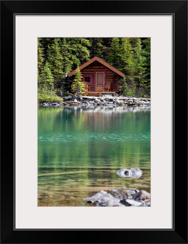 Wooden Cabin Along A Lake Shore