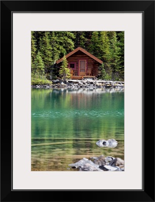 Wooden Cabin Along A Lake Shore