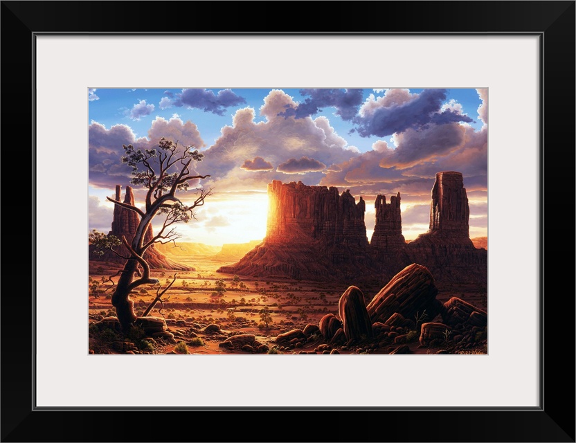 The sun setting behind the rock formations of Monument Valley.