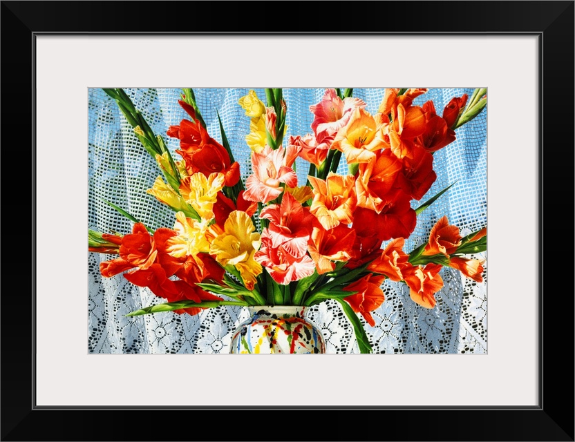 Contemporary vivid realistic still-life painting of bright red orange and yellow flowers in a multi-colored vase, against ...