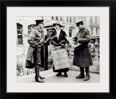 A Suffragette selling newspapers to two soldiers, c.1914