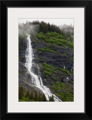 Alaska, Prince William Sound, waterfall in rainforest along Harriman Fiord