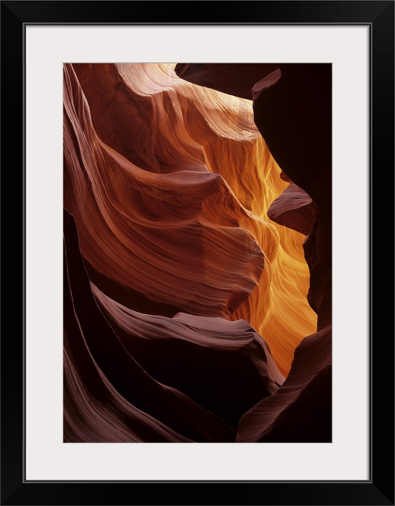 USA, Arizona, Navajo Tribal Land. Reflected sunlight creates amber walls in Antelope Canyon.