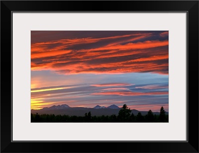 Brilliant colors compete with subtle ones over the Cascades Range of central Oregon