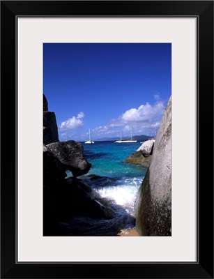 British Virgin Islands, Virgin Gorda, boulder rocks and boats in the choppy waters