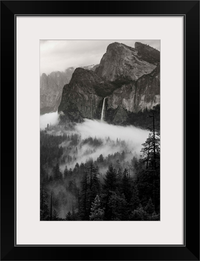 North America, USA, California, Yosemite National Park.  Black and White image of granite outcropping , Bridal Veil Falls,...