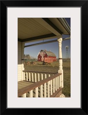 Canada, Alberta, Front Porch of Historic House Looking Towards Barn