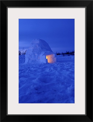 Canada, Manitoba, Churchill. Arctic igloo with candle light inside