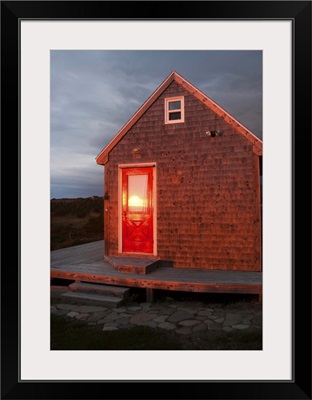 Canada, Nova Scotia, Cape Breton, Cabot Trail Cottage at sunset