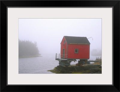 Canada, Nova Scotia, Stonehurst. Red fishing shed in fog