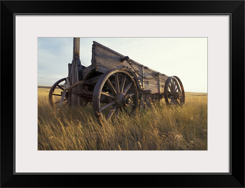 Canada, Saskatchewan, An old horse-drawn cart in a field near Maple Creek