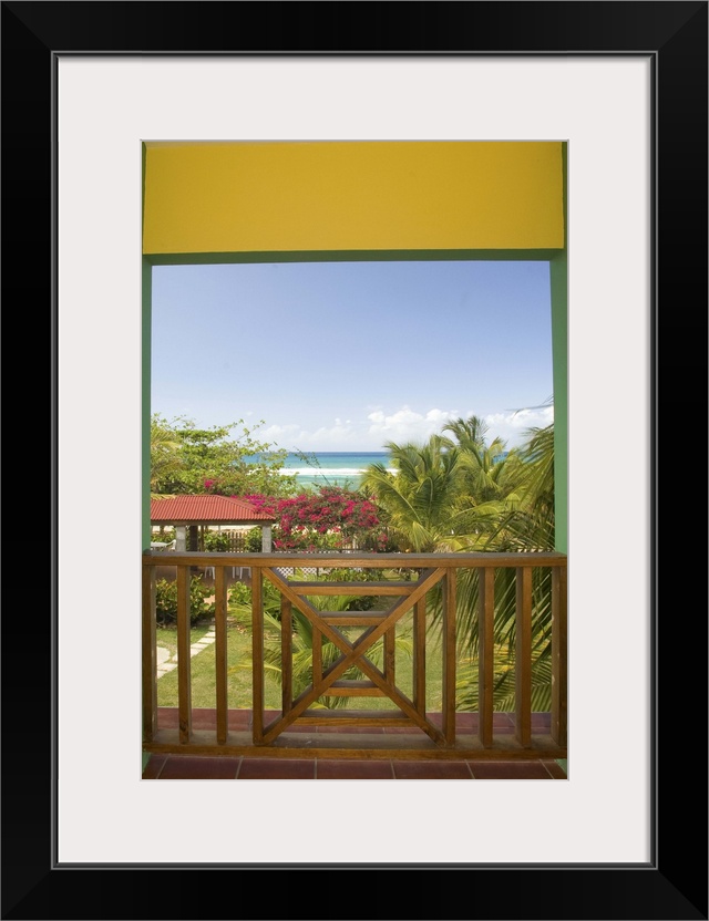 Caribbean, Puerto Rico, Vieques.  Caribbean, beach and palm trees, viewed from porch of house/hotel.  PR