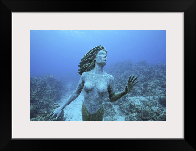 Cayman Islands, Grand Cayman Island, Underwater view mermaid sculpture in shallow coral reefs in Caribbean Sea